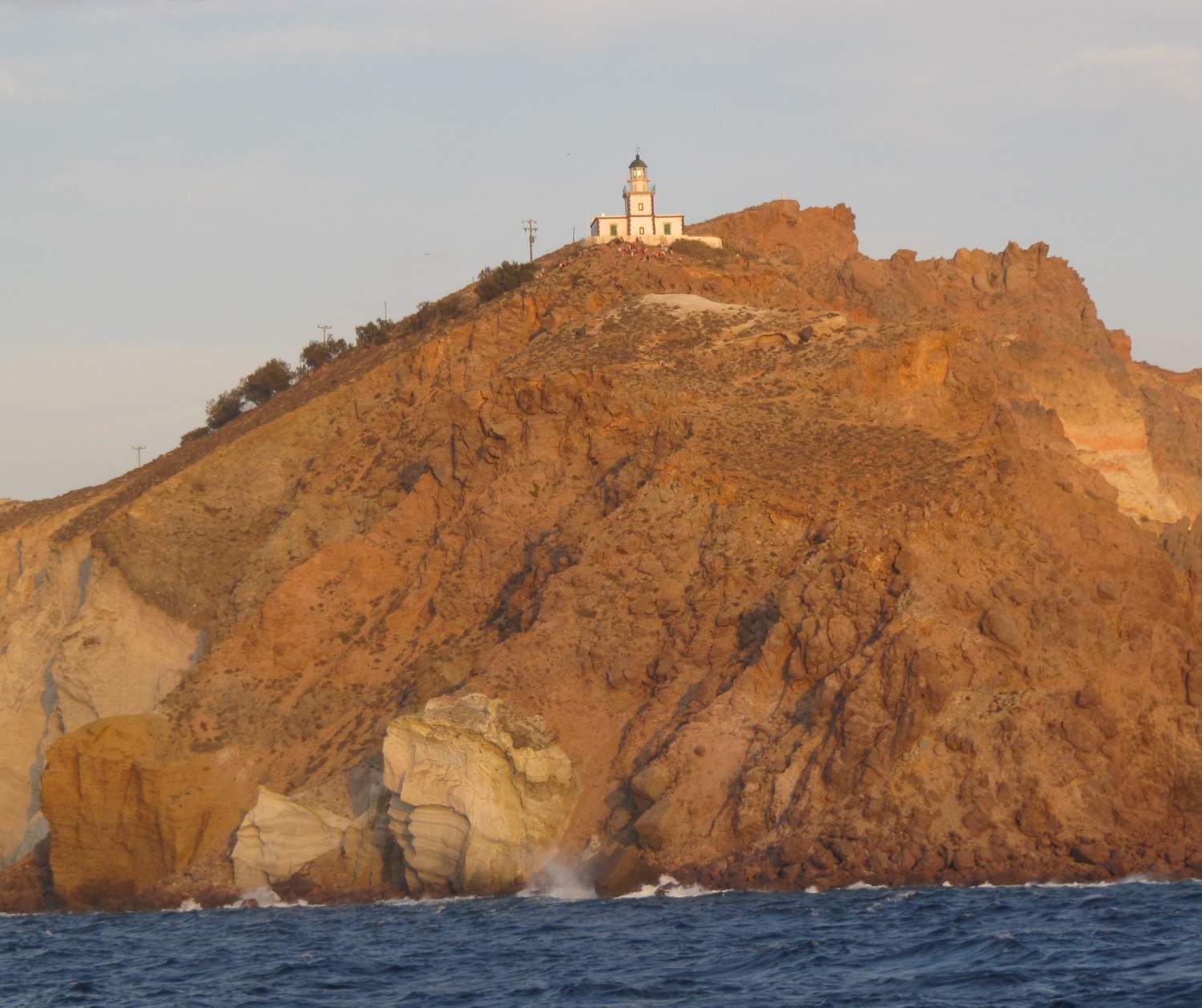 Akrotiri lighthouse at sunset on Santorini island, Greece