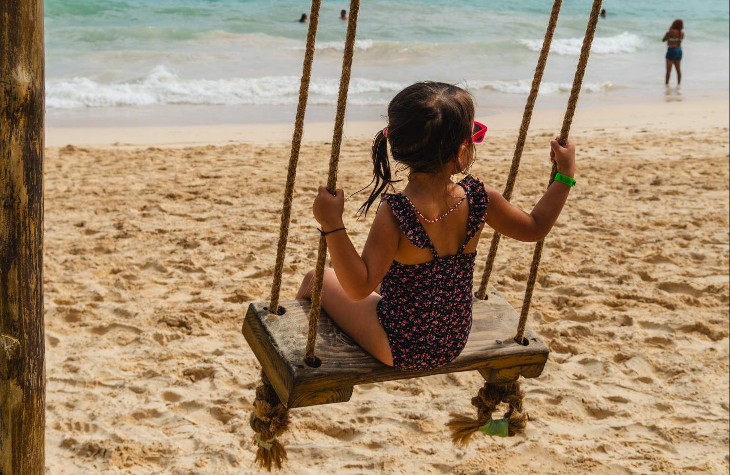 Swinging on the beach in Dominican Republic