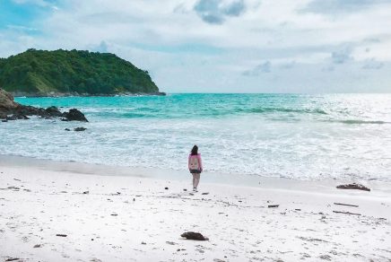 Woman on beach. Photo by Vitaly Sacred on Unsplash